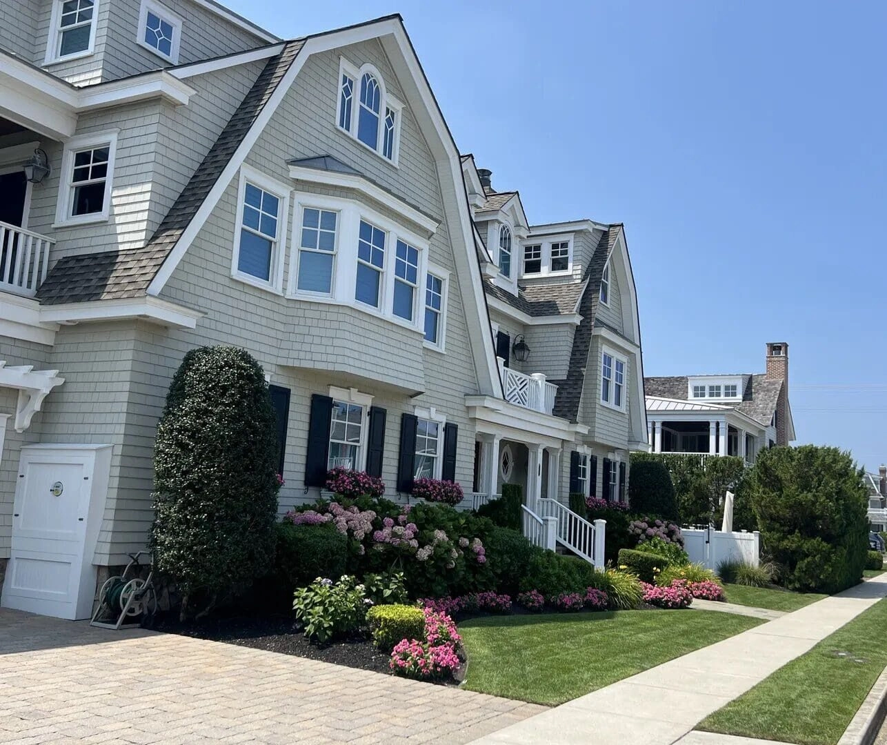 A house with flowers in front of it.